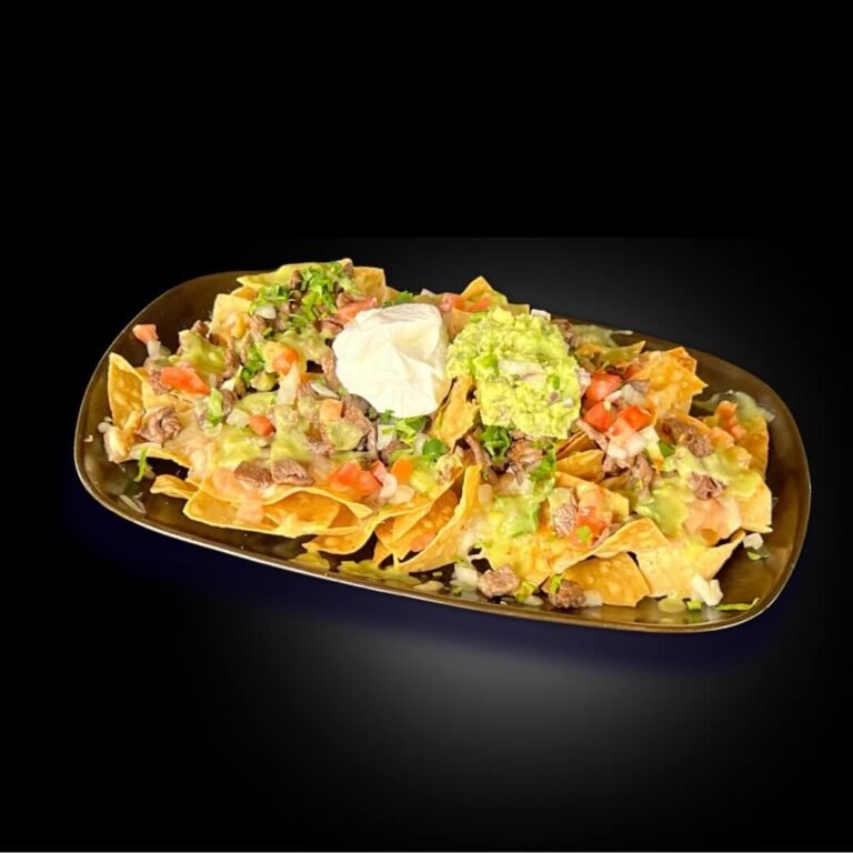 MENU 84 Nachos - Tortilla chips topped with beans, Jack Cheese, guacamole, sour cream and pico de gallo. Add one item beef, chicken, or pork